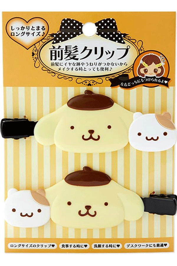 Nærbilde av de to forskjellige Pompompurin-designene på hårklemmene.